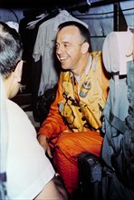 1961 - Astronaut Alan Shepard onboard helicopter after recovery of Mercury capsule