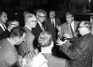 A group of NASA officials, headed by Associate Administrator Robert Seamans, toured the Marshall Space Flight Center with Dr. Wernher von Braun (pointing finger) in 1963.