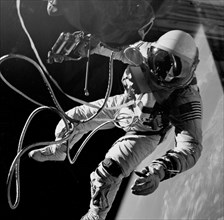 (3 June 1965) Astronaut Edward H. White II, pilot of the Gemini IV four-day Earth-orbital mission, floats in the zero gravity of space outside the Gemini IV spacecraft.