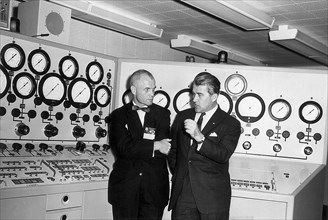 Wernher von Braun briefs Astronaut John Glenn in the control room of the Vehicle Test Section, Quality Assurance Division, Marshall Space Flight Center (MSFC), November 28, 1962.