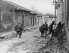 Nationalist soldiers raiding a suburb of Madrid during the Spanish Civil War ca. 1937