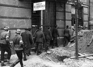 Warsaw Uprising: First German POW’s from Main Post Office building through a barricade on 7 Jasna Street (in the photo) to the PKO building on Swietokrzyska Street ca. 1944