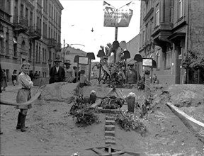 Protest of the Polish Socialist Party - Workers' protest action. In the foreground there is the improvised tomb of an unknown worker and a plaque with the inscription "Long live the workers' solidarit...