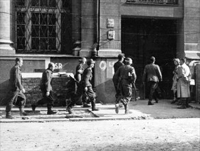 Warsaw Uprising: First German POW’s beeing taken from Main Post Office building to the PKO building on Swietokrzyska Street ca. August 1944