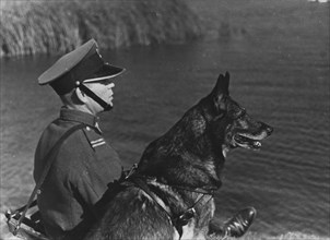 Polish Border Guard officer with a dog on the border with Germany ca. 1928-1939