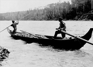Indians poling up the Skeena River 1900-1930 British Columbia
