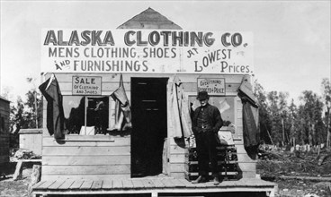 Man in front of Alaska Clothing Co. store 1900-1916