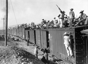 Mexico - Sonora, Yaqui Indians, enlisted in the Mexican Army, being transported by box cars 1890-1923