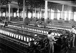 Three spinners in spinning room, 1912