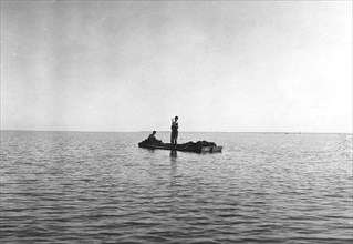 Two boys on small barge, 1912