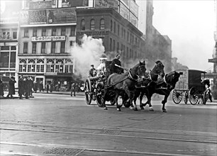 Team of horses taking fire men to a fire ca. 1910-1915