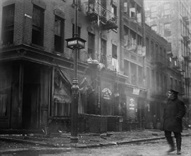Date: 1910-1915 - Firemen fighting a fire on Monroe Street