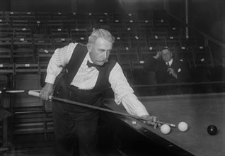 Edward Gardner playing pool ca. 1910-1915