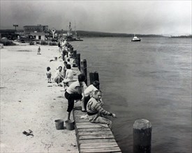 Fishing along Sandwich Bulkhead area, Cape Cod Canal 8/26/1961