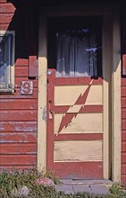 1980s United States -  Cabins cabin #9 lightning door detail Route 89 Saint Mary Montana ca. 1987
