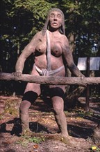 1980s United States -  Cave woman, Dinosaur Gardens, Route 23, Ossineke, Michigan 1988