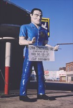 1980s United States -  Tire Man statue, 2nd Avenue South and 21st Street South, Birmingham, Alabama 1980