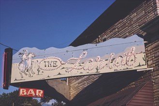 1980s America -  The Lariat Bar sign, Jackson, Nebraska 1980