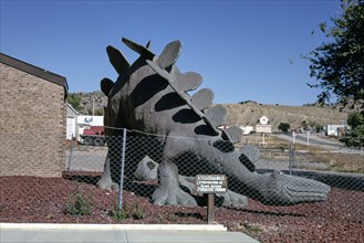 1990s United States -  Stegosaurus statue at town hall, view 2, Route 64, Dinosaur, Colorado 1991