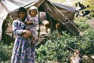 Israel April 1965:  1960s Bedouin family in a Bedouin camp in the Israel countryside