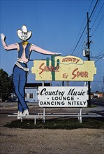 1980s America -  Saddle and Spur Lounge sign, Monroe, Louisiana 1982