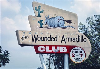 1980s America -   Wounded Armadillo Club sign, Richmond, Texas 1983