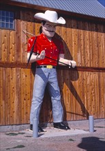1980s United States -  Cowboy statue, Genine Stamper Jewelry, Route 16, Rapid City, South Dakota 1987