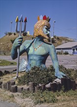 1980s United States -  Neptune statue vertical, Surf Slide, Nags Head, North Carolina 1985