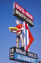 1990s United States -  Bud and Ben Mufflers sign, W Illinois Avenue, Dallas, Texas 1994