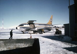 Wien Airlines airplane being loaded at the Nome Airport ca. March 1974