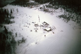 Aerial view of Salmon River roadhouse ca. March 1974