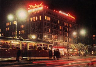 Marszalkowska Street Scene, with tram at night in front of an apartment building in Warsaw ca. 1968