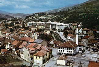 The early 1960s view of Travnik from the east end with the narrow-gauge railway passing through town ca. 1960s