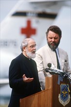 7/27/1986 - The Reverend Lawrence Jenco addresses reporters and well-wishers before his departure to Rome, Italy.