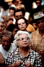 Audience member at an Auction of Household Goods in a Residential Area ca. 1975