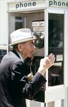 Member of the Retirement Community of South Beach using a pay telephone ca. 1975