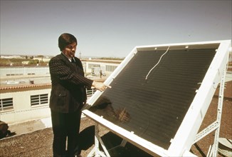 Dr. R.L. San Martin, New Mexico State University, Las Cruces shows a closed coil type solar heating panel