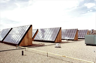 Flat plate solar heating collectors built by the Solaron Corporation, and installed on the roof of the Gump Glass Company... 05 1975