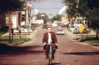 Associate County Court Judge Fred Burns on his daily bike ride to the Seward County courthouse, May 1972 Nebraska