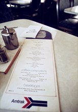 Menu on the table of the un-remodeled dining car of the Inter-American (Train #22) enroute from Fort Worth, Texas, to St Louis, Missouri, June 1974