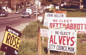 Political signs on Dodge Street, one of the city's main thoroughfares, May 1973 Omaha, NE