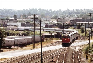 The Coast Starlight (train #11) pulls into the Tacoma Washington passenger train depot, July 1974