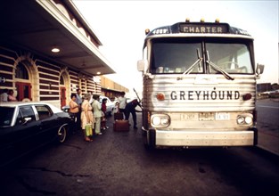 Train passengers bound for St. Louis, Missouri, board a chartered bus in Fort Worth, Texas, June 1974.