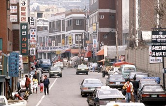 1987 - A street in the market district of the city (possibly Itaewon S. Korea).