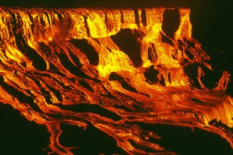 1969 - Lava falls pour into 'Alae Crater at 11 p.m., HST, on August 5, 1969, supplied by a high lava fountain at Mauna Ulu, 600 m (2,000 feet) away. The falls, more than 100 m (330 ft) high and 300 m ...