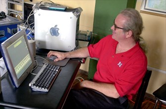 Worker using a Macintosh computer