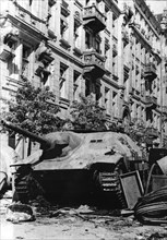 Warsaw Uprising - Polish barricade on the Napoleon square build around German Jagdpanzer 38(t) "Hetzer" tank captured by the Home Army ca. 1944