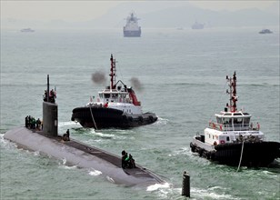 (May 20, 2011) The Los Angeles-class attack submarine USS Hampton (SSN 767) gets underway from Victoria Harbor after receiving support from the submarine tender USS Frank Cable (AS 40).