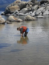 USGS worker collecting water samples at Sand Harbor, Lake Tahoe ca. 2010