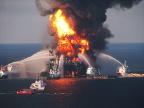 Fire boat response crews battle the blazing remnants of the off shore oilrig Deepwater Horizon on April 21, 2010